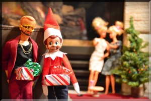 elf on a shelf dick in a box justin timberlake christmas santa hat barbie doll party scene naughty holiday dolls ken